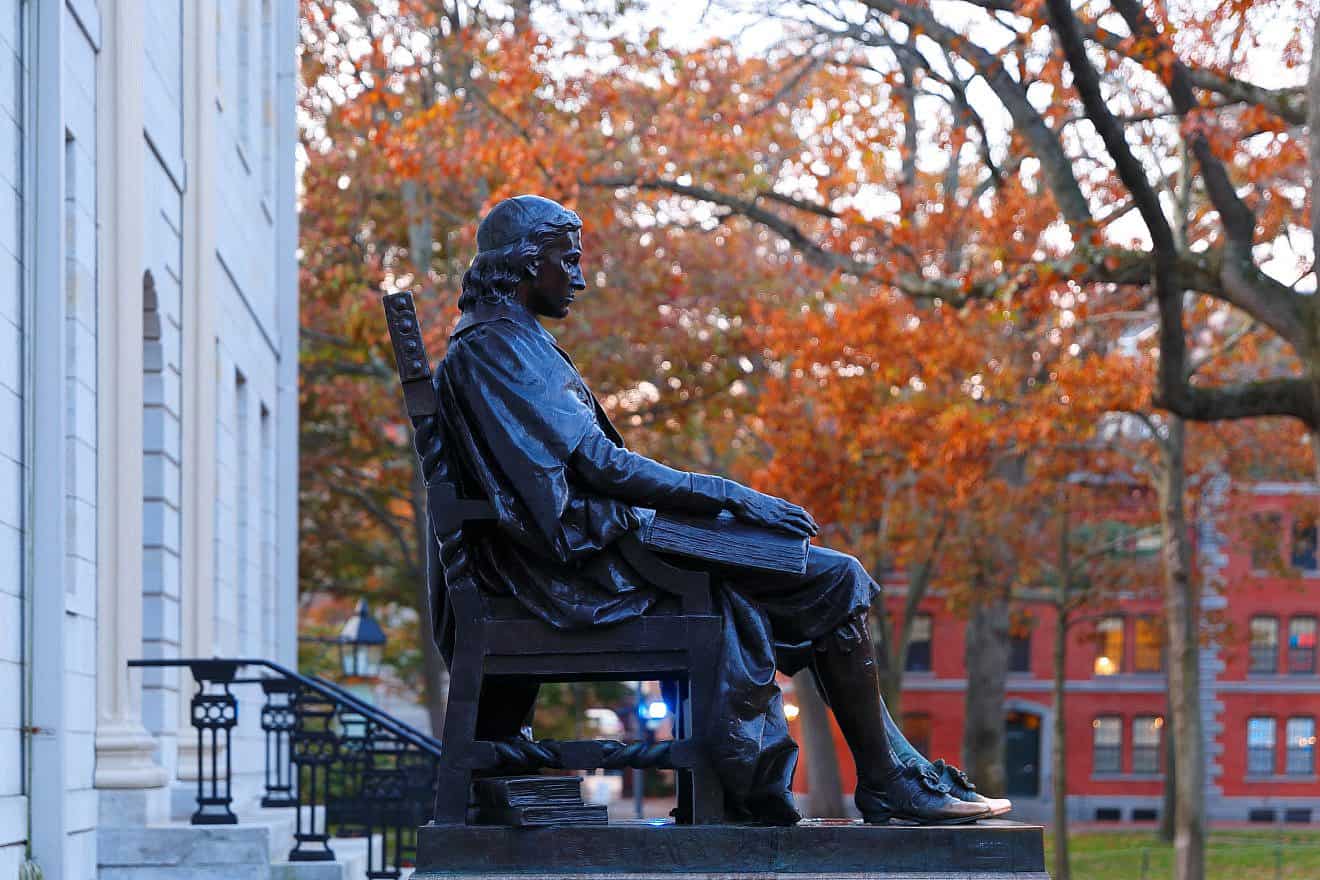 Statue of John Harvard on the Harvard University campus in Cambridge, Mass. Credit: Jay Yuan/Shutterstock.