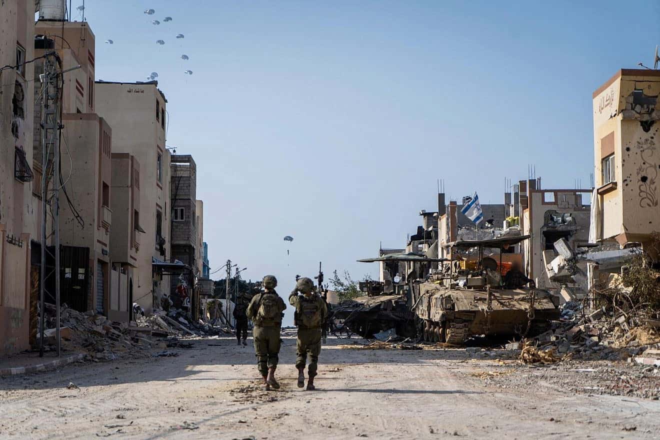Israeli troops observe humanitarian aid deliveries from the air as part of a multinational operation, southern Gaza, Feb. 27, 2024. Credit: IDF.