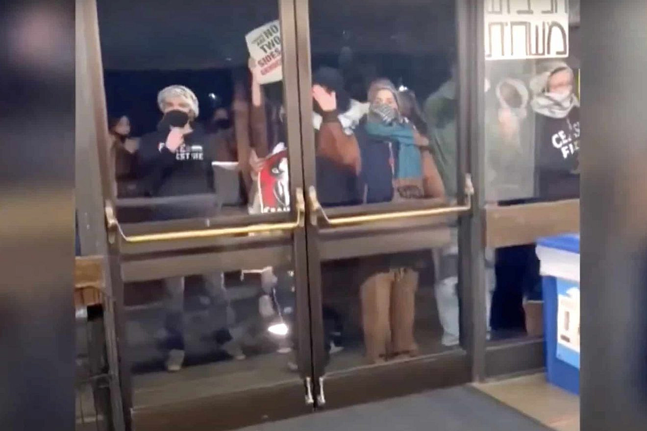 Anti-Israel protesters at the University of California, Berkeley, bang on glass doors before eventually breaking them on Feb. 26, 2024. Source: NBC Bay Area/YouTube.