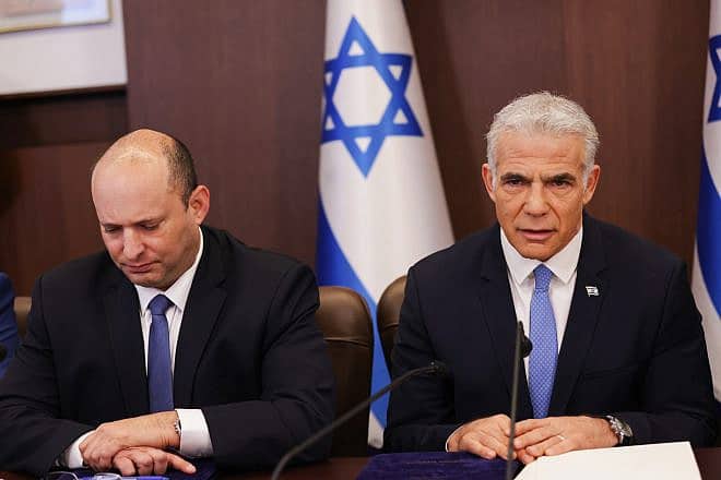 Then-Israeli Prime Minister Yair Lapid leads a cabinet meeting at the Prime Minister's Office in Jerusalem on Aug. 14, 2022. Photo by Ohad Zwigenberg/POOL.
