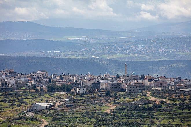 The Judea and Samaria security barrier as seen from Kibbutz Meirav, with Jalbun and Jenin in the background. Photo by Doron Horowitz/Flash90.