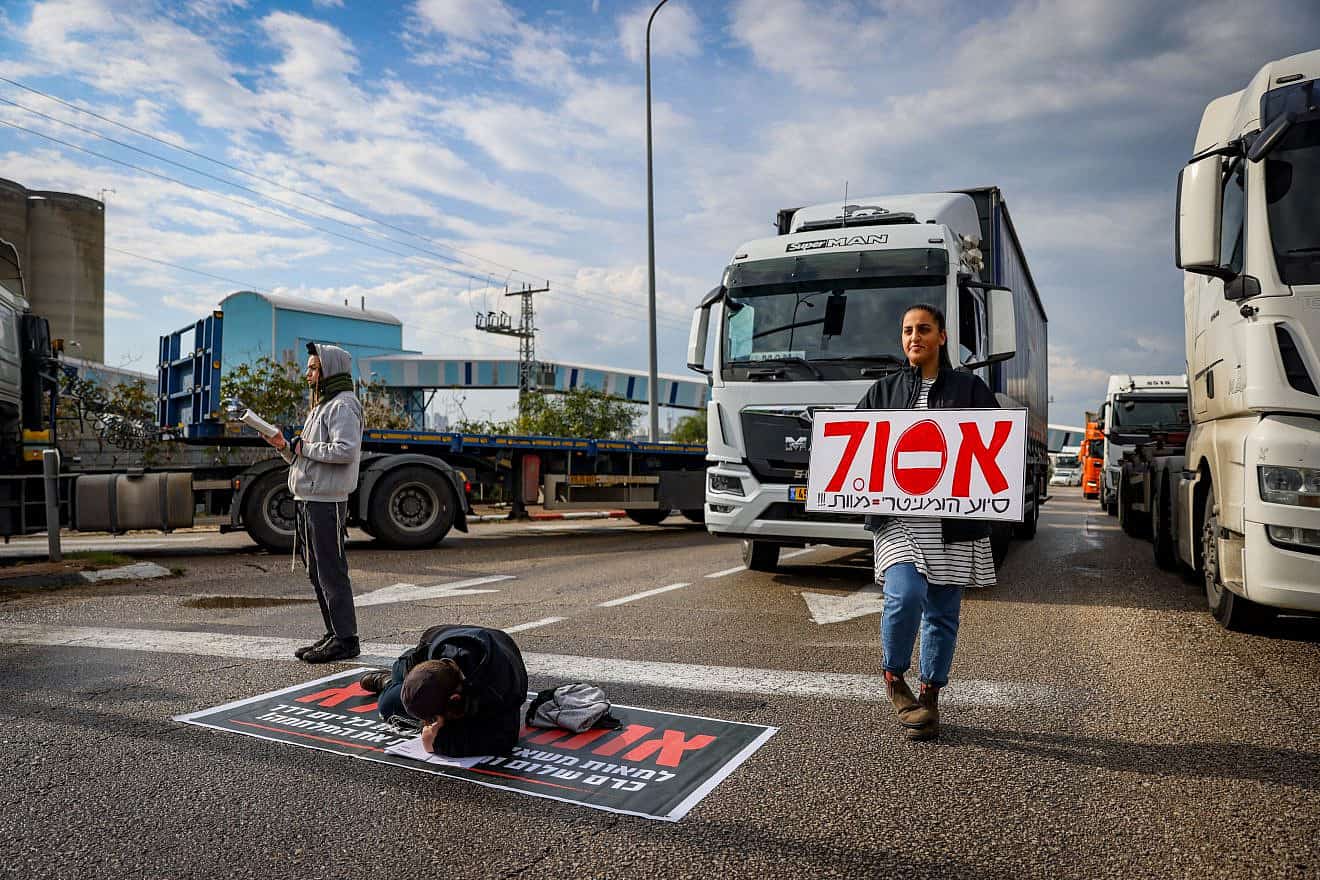 People block the entrance to Ashdod Port during a protest against aid trucks entering the Gaza Strip, Feb. 1, 2024. Photo by Chaim Goldberg/Flash90.