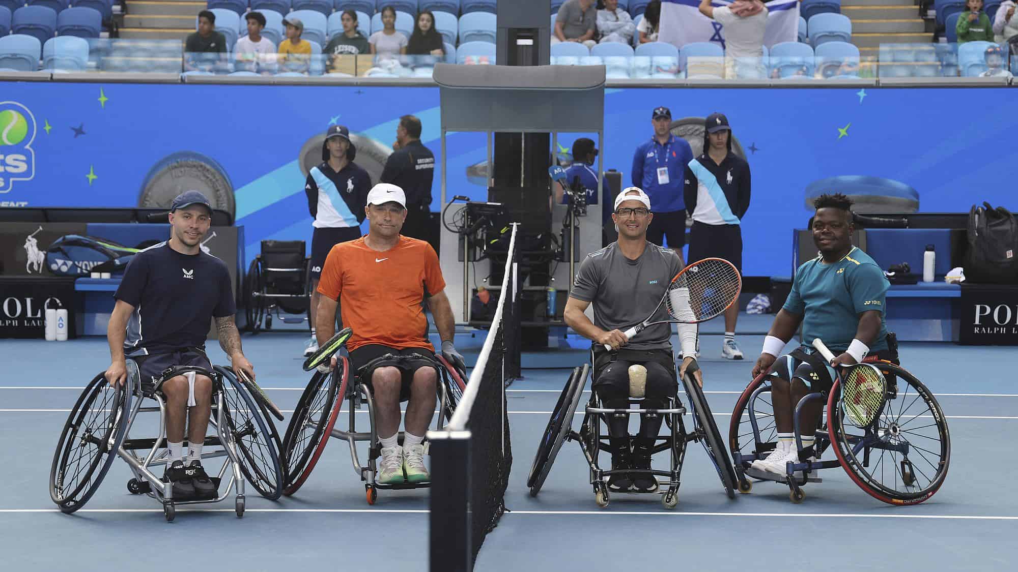 From left: Andy Lapthorne (GBR) and David Wagner (USA) with Guy Sasson (ISR) and Donald Ramphadi (RSA) during the coin toss of the Men's Wheelchair Doubles final at the Australian Open in Melbourne, Jan. 26, 2024. Photo by David Mariuz/Tennis Australia.