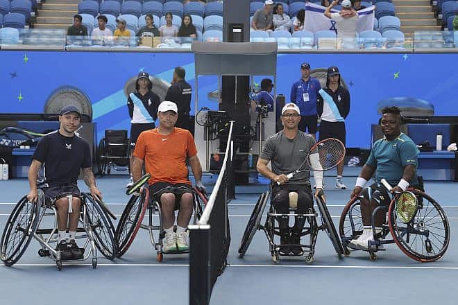 From left: Andy Lapthorne (GBR) and David Wagner (USA) with Guy Sasson (ISR) and Donald Ramphadi (RSA) during the coin toss of the Men's Wheelchair Doubles final at the Australian Open in Melbourne, Jan. 26, 2024. Photo by David Mariuz/Tennis Australia.