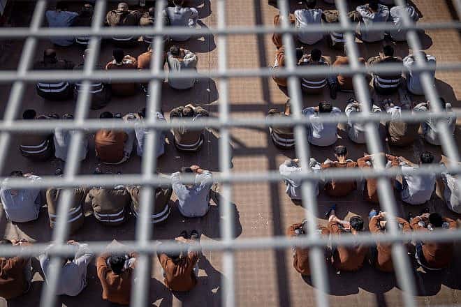 Hamas terrorists who were caught during the Oct. 7 massacre and during the Israel Defense Forces operation in the Gaza Strip, at a courtyard in a prison in southern Israel, Feb. 14, 2024. Photo by Chaim Goldberg/Flash90.