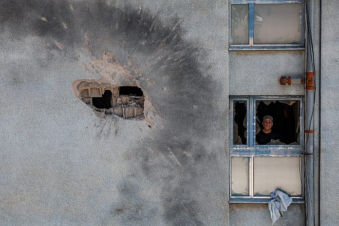 Damage after a rocket fired by Hezbollah in Lebanon hit a building in the northern Israeli town of Kiryat Shmona, Feb. 11, 2024. Photo by David Cohen/Flash90.