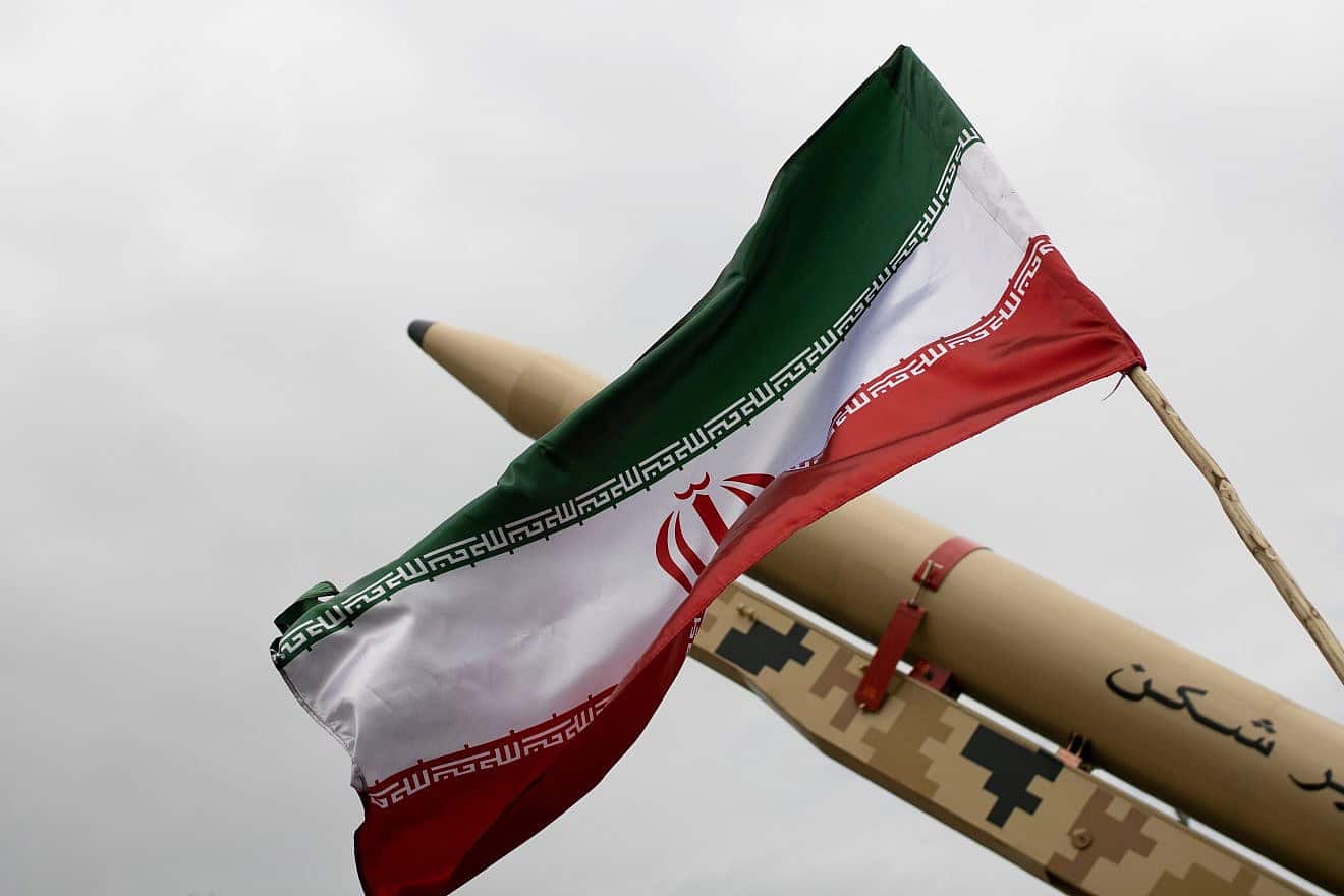 An Iranian flag over a missile, April 2022. Credit: Mohasseyn/Shutterstock.