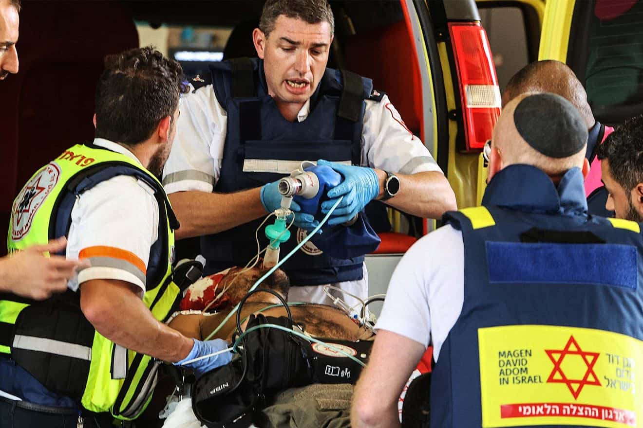 Magen David Adom medics and first responders assist a patient in need. Credit: MDA.