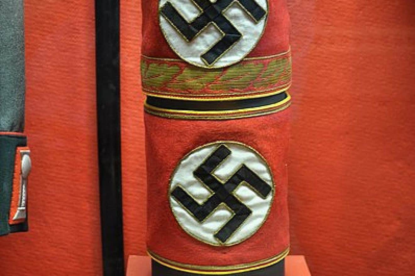Armband of the German Nazi Party, worn around the upper left sleeve of the uniform tunic and bearing a swastika. Credit: Joe Mabel via Wikimedia Commons.
