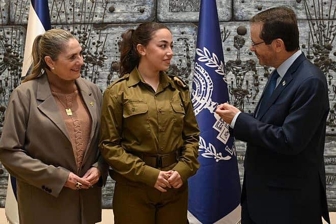 Cpl. Ori Megidish meets with Israeli President Isaac Herzog and his wife, Michal, Jan. 11, 2024. Photo by Haim Zach/GPO.