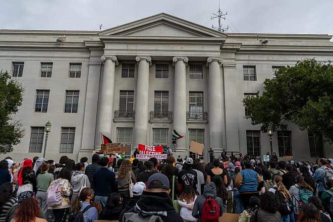 Students hold up anti-Israel signs and Palestinian flags at an anti-Israel protest in front of Sproul Hall at the University of California, Berkeley, on Oct. 25, 2023. Credit: Kefr4000 via Wikimedia Commons.