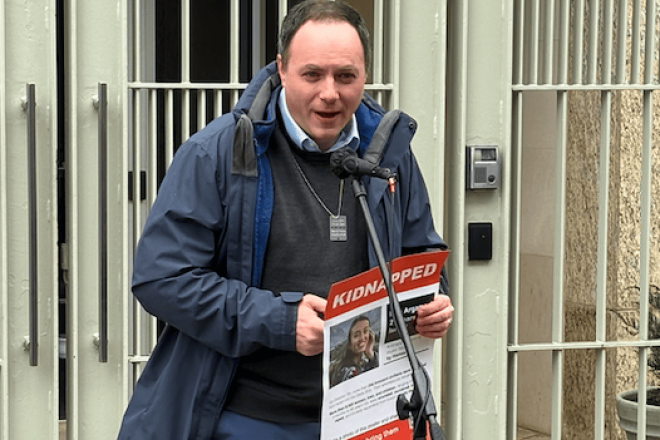 Jason Pressberg, director of Development at Americans for Ben-Gurion University (A4BGU) for the Baltimore and Greater Washington, D.C., communities, holds a poster of hostage Noa Argamani (a Ben-Gurion University of the Negev student) at the gathering on Feb. 23 outside the Embassy of Qatar. Credit: Courtesy of A4BGU.