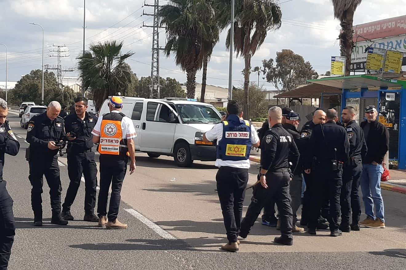 Security personnel at the scene of a terrorist shooting at the Re'em Masmiya Junction, near Kiryat Malachi in southern Israel, Feb. 16, 2024. Credit: Magen David Adom.