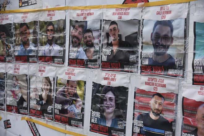 Photos of Israeli hostages held by Hamas in Gaza are seen at a protest camp near the Knesset in Jerusalem, Jan. 14, 2024. Photo by Yoav Dudkevitch/TPS.