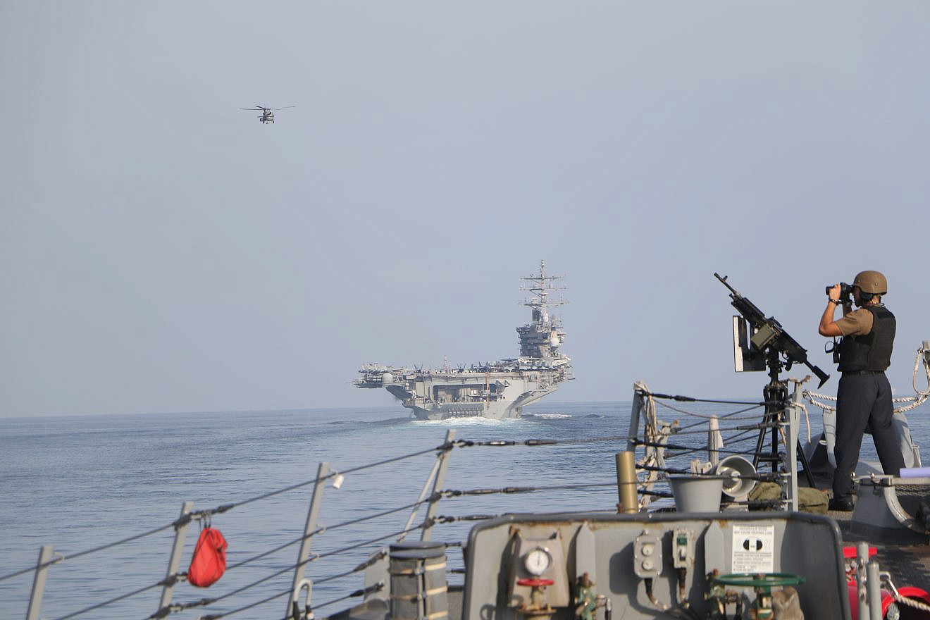 The “USS Dwight D. Eisenhower” and other naval ships in the Strait of Hormuz on Nov. 26, 2023. Credit:  Information Technician Second Class Ruskin Naval/U.S. Navy Photo.