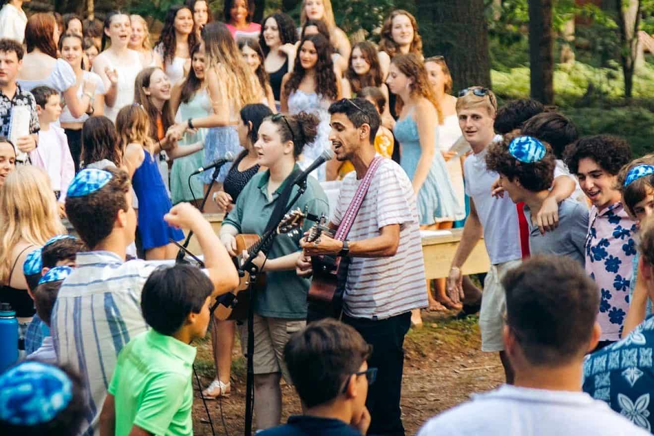 Jewish Agency summer shaliach leading Shabbat singing during summer 2023. Credit: Photo by Omer Shabtay