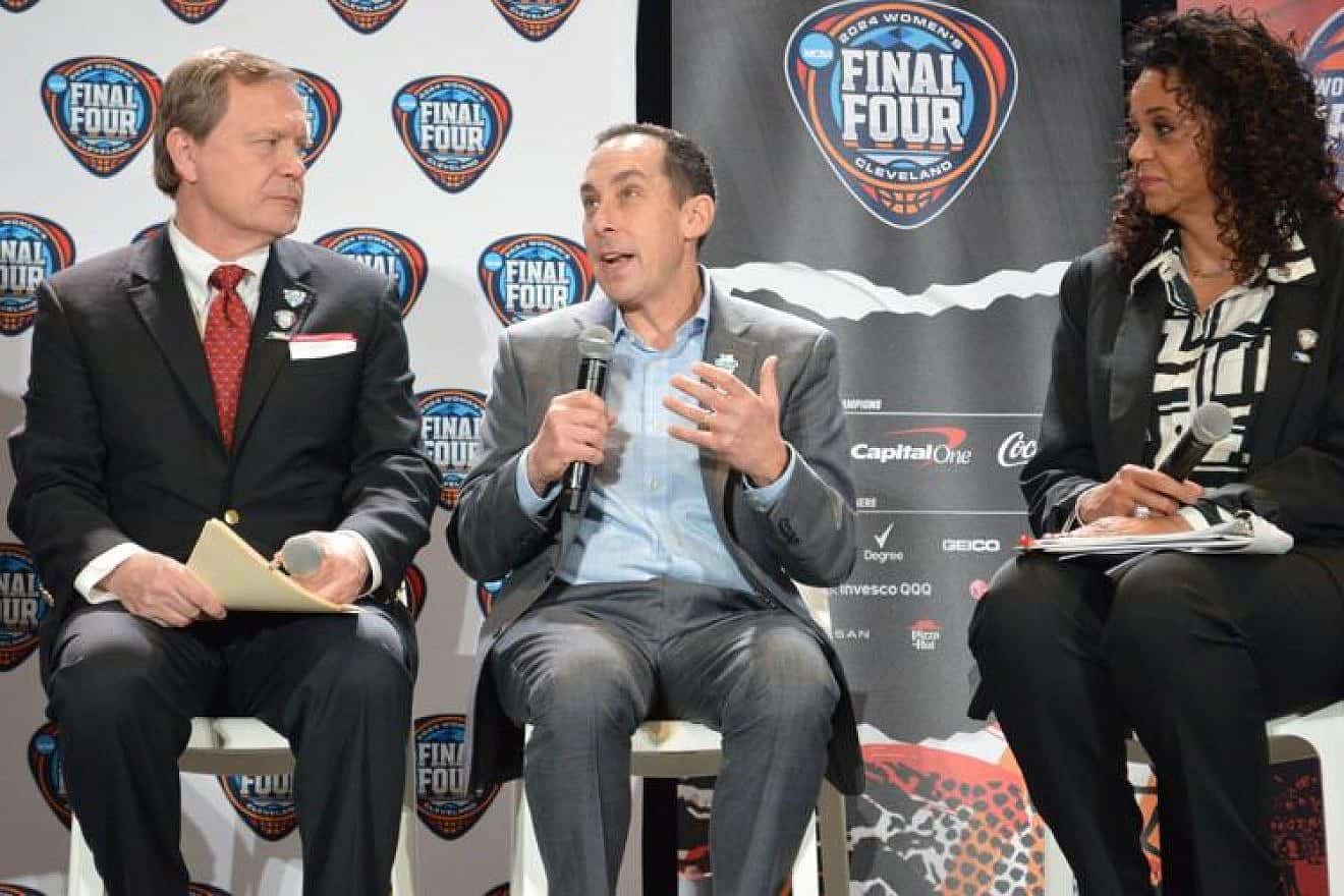 David Gilbert (center), president and CEO of the Greater Cleveland Sports Commission, discusses the Women's NCAA Final Four with Jon Steinbrecher, commissioner of the Mid-American Conference, and ESPN sportscaster Carolyn Peck during a press conference at Rocket Morgage FieldHouse arena in Cleveland on Feb. 27, 2024. Credit: Alexandra Golden/Cleveland Jewish News.