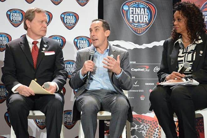 David Gilbert (center), president and CEO of the Greater Cleveland Sports Commission, discusses the Women's NCAA Final Four with Jon Steinbrecher, commissioner of the Mid-American Conference, and ESPN sportscaster Carolyn Peck during a press conference at Rocket Morgage FieldHouse arena in Cleveland on Feb. 27, 2024. Credit: Alexandra Golden/Cleveland Jewish News.
