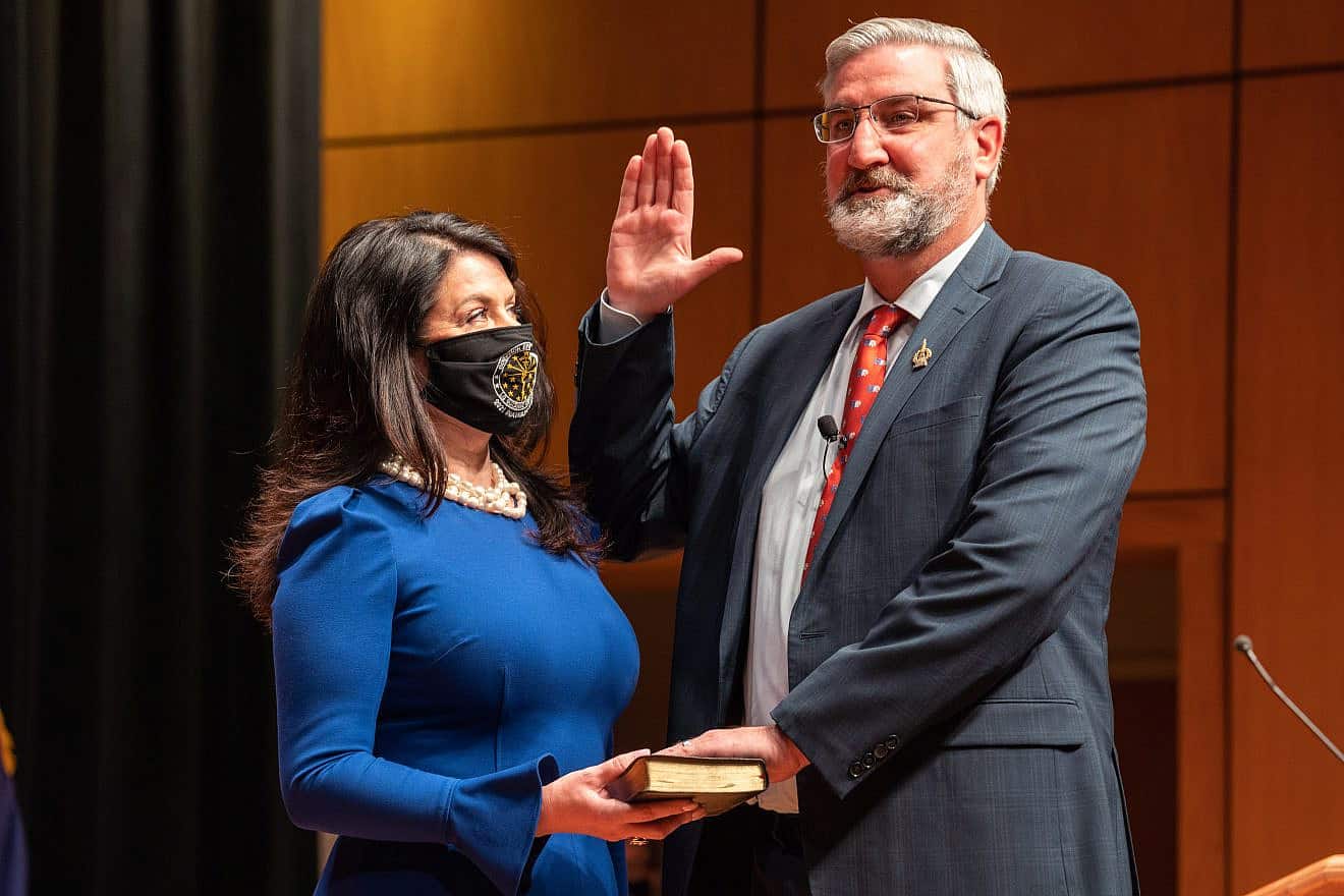Eric Holcomb is inaugurated to a second term as the 51st governor of Indiana, alongside his wife, Janet Holcomb, on Jan. 11, 2021. Credit: Wikimedia Commons.