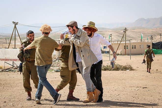 Israeli soldiers celebrate Purim at an army base in southern Israel, Feb. 28, 2018. Photo by Liba Farkash/Flash90.
