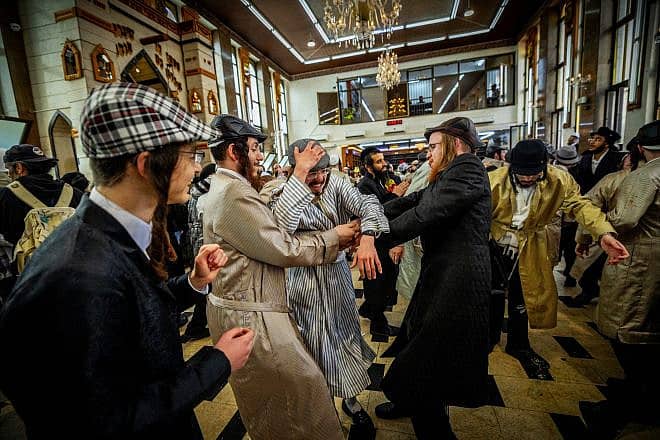 Haredi Jews celebrate Purim at a yeshivah in the Mea She'arim neighborhood of Jerusalem, March 8, 2023. Credit: Yonatan Sindel/Flash90.