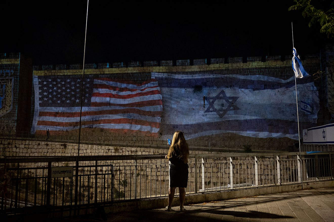 The American and Israeli flags are projected on the walls of Jerusalem's Old City to thank U.S. President Joe Biden for his support, Oct. 18, 2023. Photo by Yonatan Sindel/Flash90.