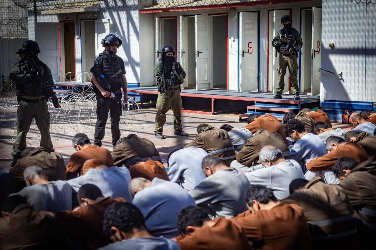 Israel Prison Service personnel guard terrorists caught during the Oct. 7 massacre and IDF operations in the Gaza Strip, at a prison in southern Israel, Feb. 14, 2024. Photo by Chaim Goldberg/Flash90.