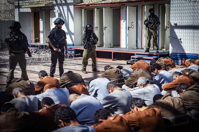 Israel Prison Service personnel guard terrorists caught during the Oct. 7 massacre and IDF operations in the Gaza Strip, at a prison in southern Israel, Feb. 14, 2024. Photo by Chaim Goldberg/Flash90.