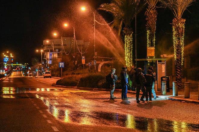 Israeli security forces inspect damage caused by a rocket fired from Lebanon in Kiryat Shmona, Feb. 15, 2024. Photo by Ayal Margolin/Flash90.