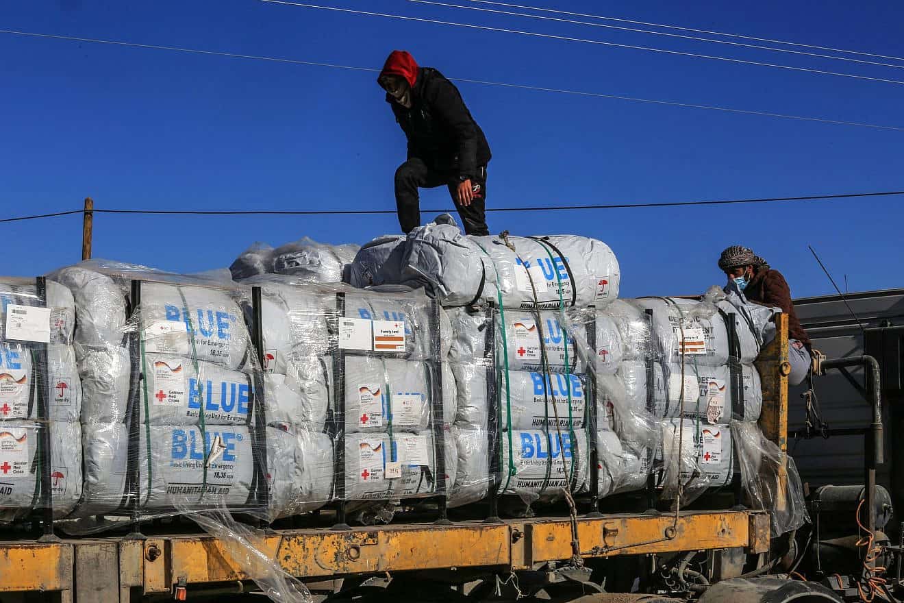 Trucks with humanitarian aid arrive on the Gaza side of the Kerem Shalom border crossing, Feb. 17, 2024. Photo: Abed Rahim Khatib/Flash90.