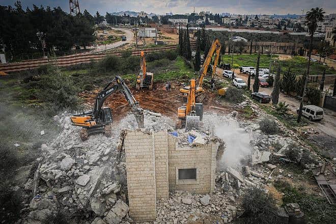 Security forces destroy a building built without a permit in the Jerusalem neighborhood of Beit Hanina, Feb. 20, 2024. Photo by Jamal Awad/Flash90.