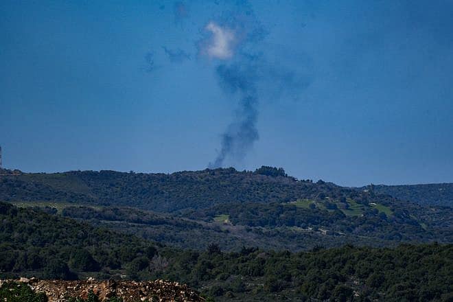Smoke rises after rockets fired from Lebanon hit a military base near the Israeli border, March 5, 2024. Photo by Ayal Margolin/Flash90.