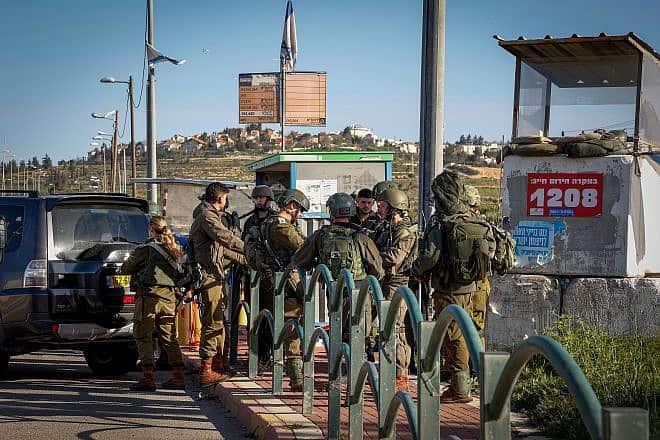 Security forces at the site where David Ben Avraham, a Palestinian convert to Judaism, was shot by IDF soldiers, near Elazar in Gush Etzion, March 21, 2024. Photo by Gershon Elinson/Flash90.