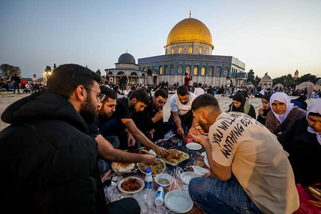 Palestinians break their fast outside the Dome of the Rock on the Temple Mount in Jerusalem during Ramadan, March 30, 2024. Photo by Jamal Awad/Flash90.