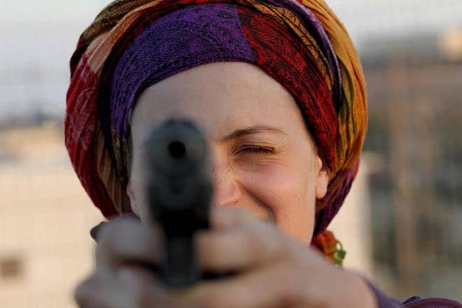 A Jewish resident of Judea and Samaria practices shooting a gun, Sept. 21, 2011. Photo by Nati Shohat/Flash90.