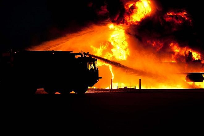 Fire truck putting out flames. Credit: Pixabay.
