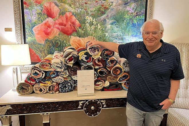 Former U.S. Ambassador to Israel David Friedman presents IDF families with handmade quilts from the Cotton Boll Quilt Guild of Auburn, Alabama, March 19, 2024. Credit: David Friedman/X.
