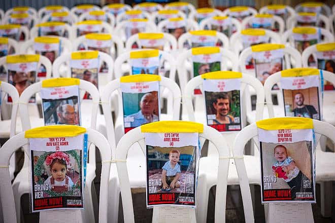 Empty chairs in the northern Israeli city of Tzfat show pictures of civilians being held hostage by Hamas terrorists in the Gaza Strip, Nov. 14, 2023. Photo by David Cohen/Flash90.