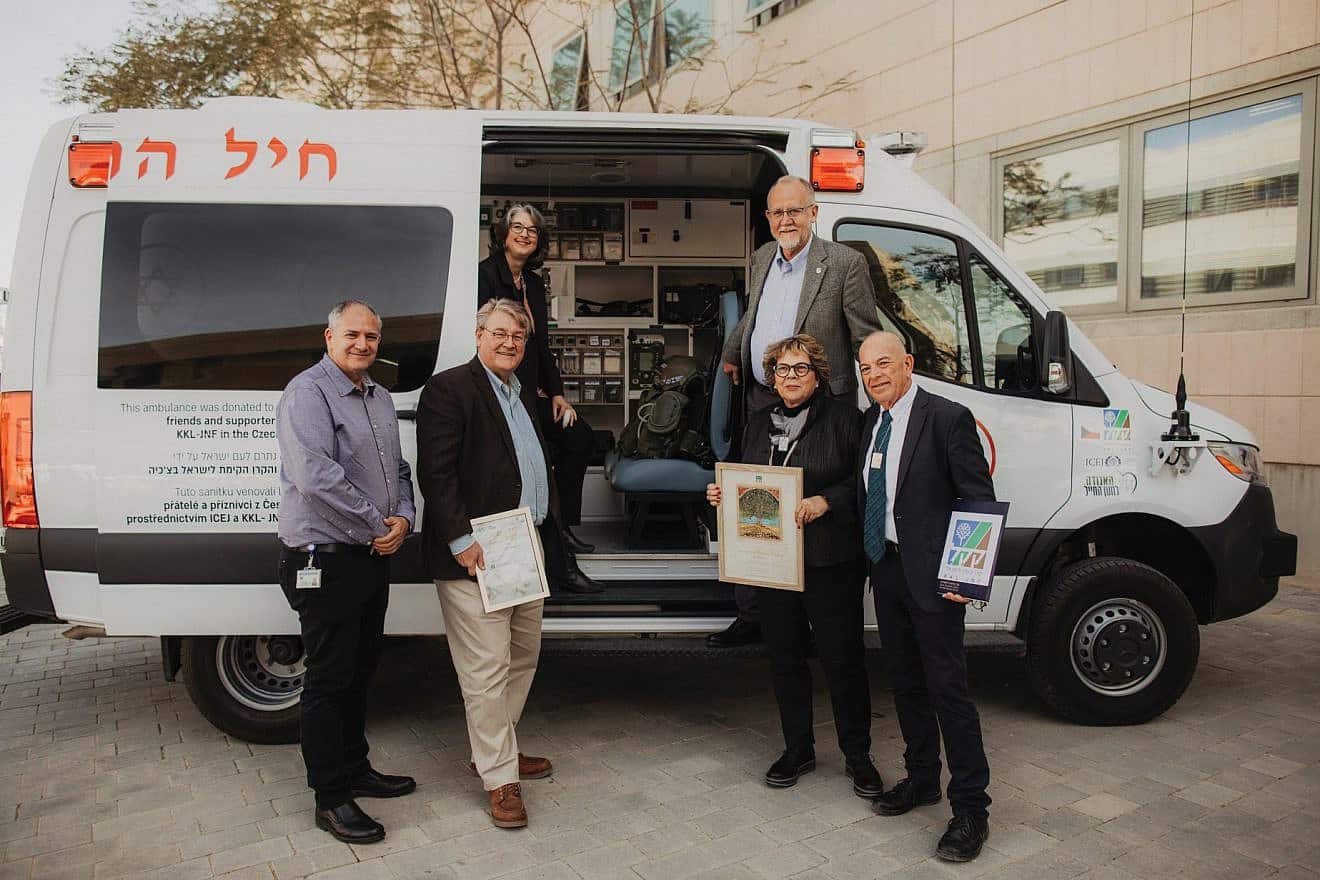 Officials from the International Christian Embassy Jerusalem and the Jewish National Fund-USA dedicate a new military ambulance for Israeli communities in the Gaza border area. Credit: Courtesy of ICEJ.