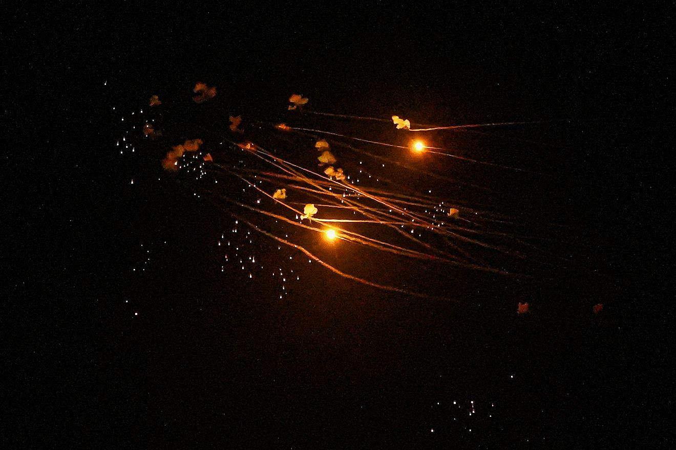 An Iron Dome aerial-defense battery fires interceptor missiles against rockets fired by Hezbollah in Lebanon, as seen over Kiryat Shmona, March 5, 2024. Photo by Ayal Margolin/Flash90.