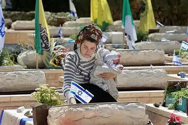 Meitar Eliyahu, the widow of St. Sgt. (res.) Yedidya Eliyahu, at his grave at the Mount Herzl Military Cemetery in Jerusalem. Photo by Oren Cohen.