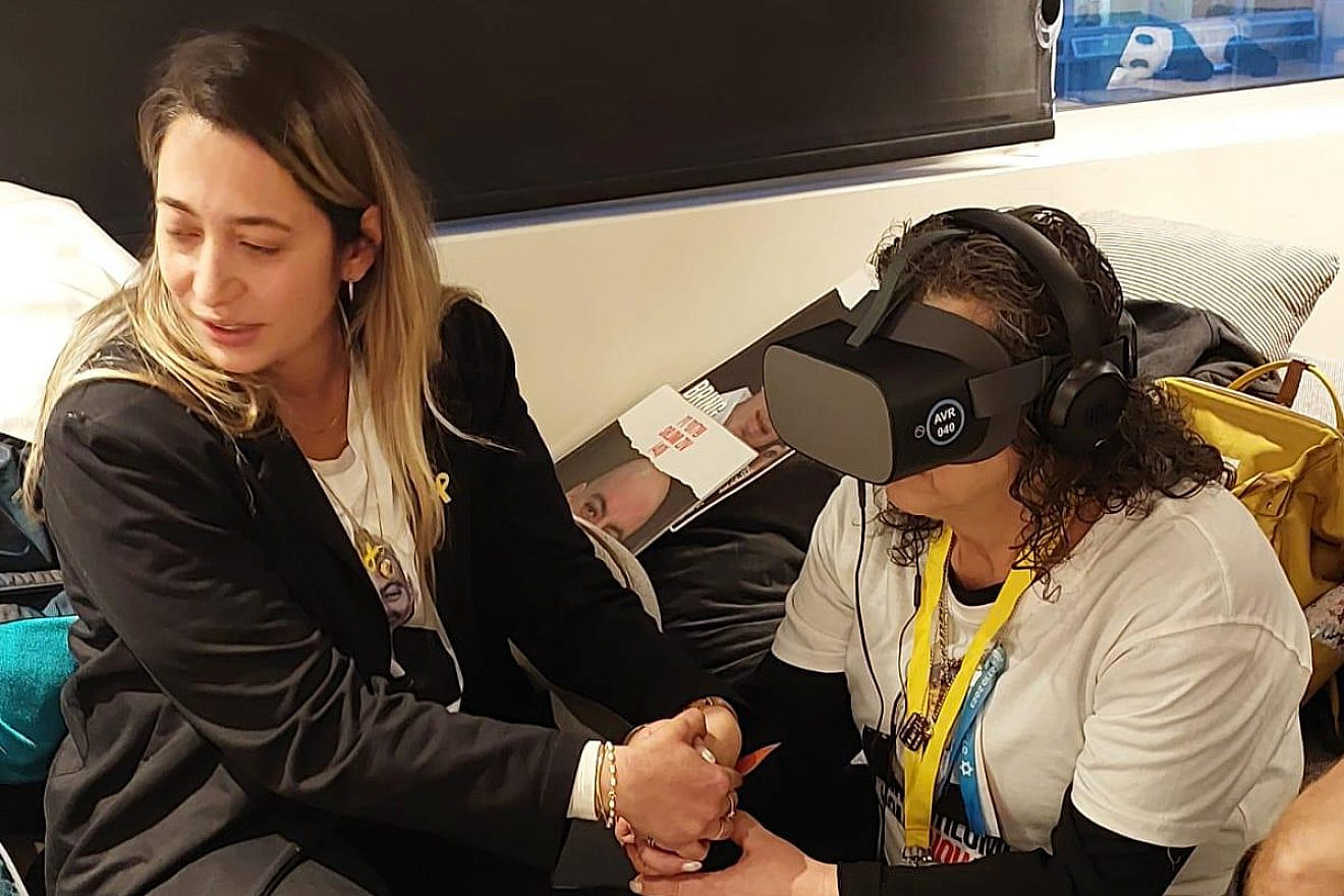 Hamas hostage Shlomi’s Ziv's mother Rozita views "Shlomi's Glasses" for the first time, together with her neice, Liat Ariel, who created the 8-minute virtual reality experience. Photo courtesy of Liat Ariel.