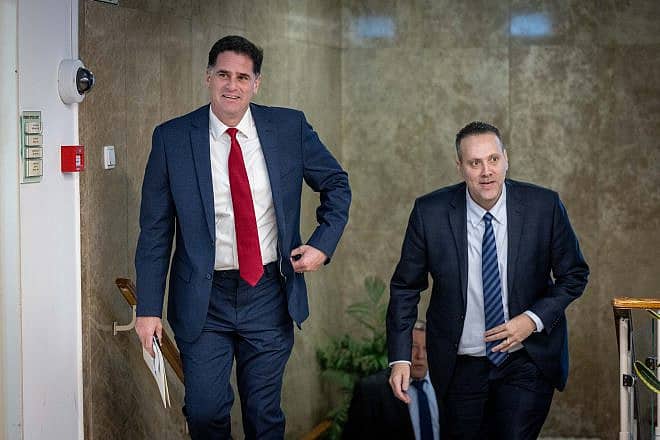 Israeli Minister of Strategic Affairs Ron Dermer and Minister of Culture and Sport Miki Zohar arrive t a government conference at the Prime Minister's Office in Jerusalem on Jan. 3, 2023. Photo by Yonatan Sindel/Flash90.