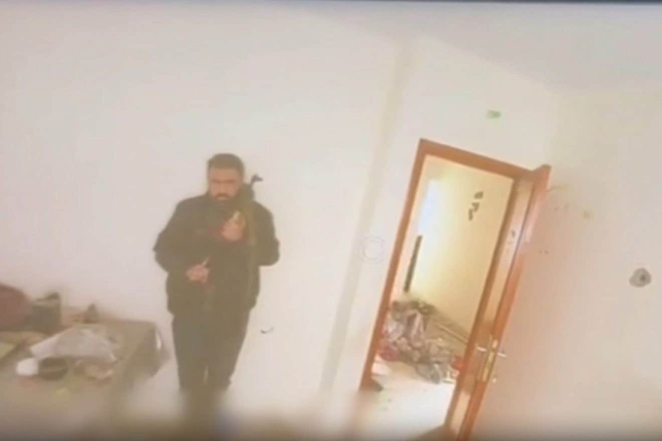 A screenshot from IDF drone video of a terrorist hiding in the Hamad complex in Khan Yunis, southern Gaza, March 20, 2024. Credit: IDF.