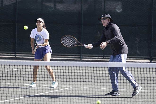 Inbar Poni from Ramat Hasharon, Israel, plays alongside legendary tennis coach Brad Gilbert at St. Andrews Country Club in Boca Raton, Fla. Credit: Courtesy of the Israel Tennis and Education Centers.