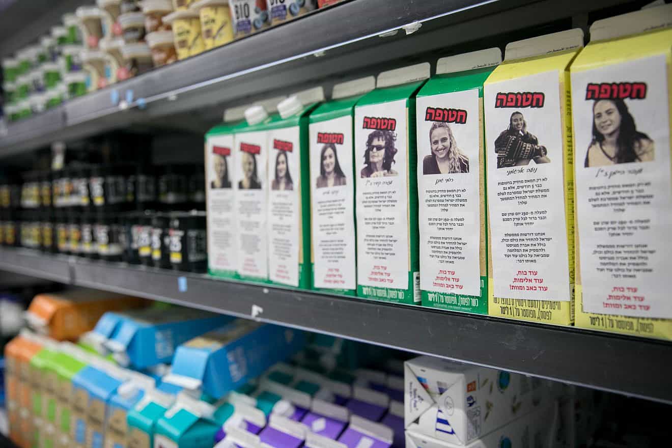 Stickers with photos and descriptions of Israelis still being held hostage by Hamas terrorists in the Gaza Strip, been posted on milk cartons at a supermarket in Tel Aviv, March 20, 2024. Photo by Miriam Alster/Flash90.
