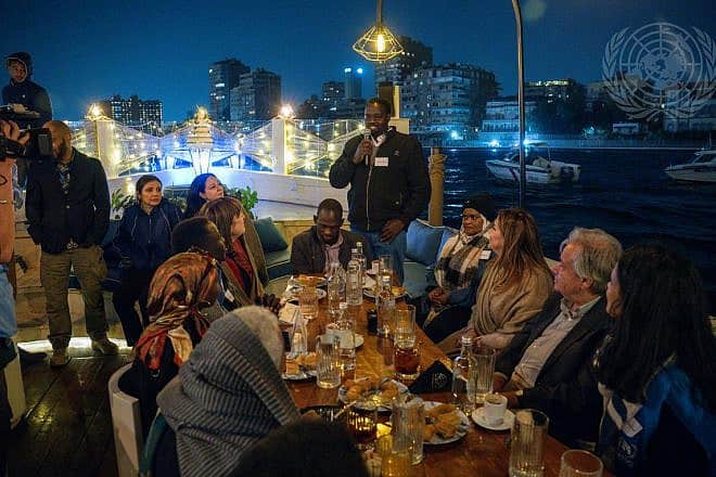 U.N. Secretary-General António Guterres (second from right) shares Iftar with Sudanese refugees in Egypt during his annual solidarity visit to a country that observes Ramadan. Credit: Mark Garten/U. N. Photo.