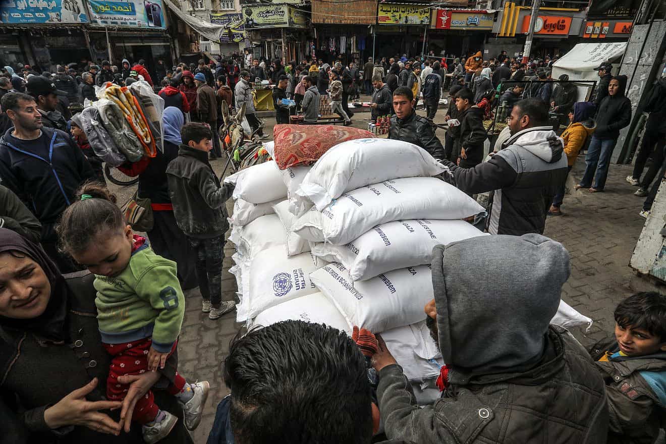 Palestinians receive food supplies at an UNRWA school in Rafah, the southern Gaza Strip, Jan. 28, 2024. Photo by Abed Rahim Khatib/Flash90.