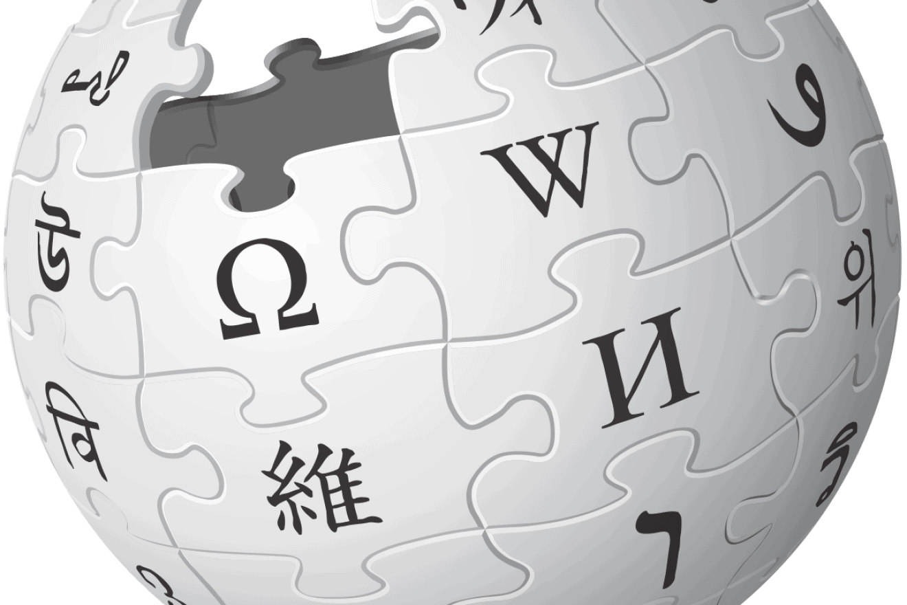 An incomplete sphere made of large, white jigsaw puzzle pieces, each one containing a glyph from a different writing system. Credit: Wikipedia.