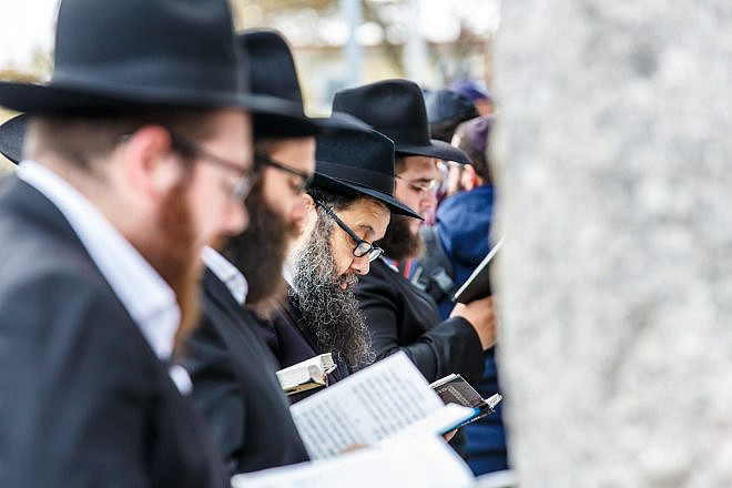 Chabad-Lubavitch rabbis pray at the gravesite of the Lubavitcher Rebbe, Rabbi Menachem M. Schneerson, in the Queens borough of New York on November 25, 2016. Credit: Eliyahu Parypa/Chabad.org.